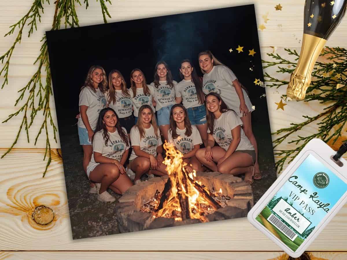 Group of young women enjoying summer camp around a campfire, celebrating friendship and outdoor activities.